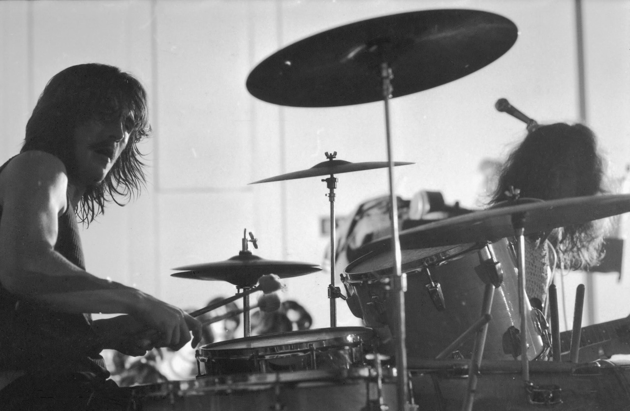 Led Zeppelin drummer John Bonham in rehearsal (singer Robert Plant is obsc. R); prob. Boston.